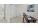 Bright office space featuring a dark wood desk, white closet doors, and neutral walls at 308 Fleming Dr, Durham, NC 27712