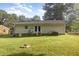 Exterior of home and the backyard with a fire pit area at 308 Plaza Dr, Garner, NC 27529