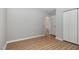 A view into a clean bedroom with wood-look flooring and closet at 308 Plaza Dr, Garner, NC 27529