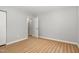 Inviting bedroom featuring luxury vinyl plank flooring, neutral paint, and closet at 308 Plaza Dr, Garner, NC 27529