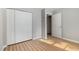 Bedroom featuring a large closet with bi-fold doors and light wood-look flooring at 308 Plaza Dr, Garner, NC 27529