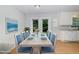 Stylish dining area with seating for six, adjacent to the kitchen, bathed in natural light at 308 Plaza Dr, Garner, NC 27529