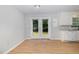 Light-filled dining area with wood floors and direct access to the backyard, perfect for indoor-outdoor living at 308 Plaza Dr, Garner, NC 27529