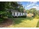 Quaint single-story home with a well-kept lawn and mature trees, offering a peaceful setting at 308 Plaza Dr, Garner, NC 27529