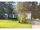 Well-maintained front yard with green lawn and mature landscaping, enhancing the home's curb appeal at 308 Plaza Dr, Garner, NC 27529
