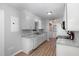 Bright kitchen features white cabinets, granite countertops, and stainless steel appliances at 308 Plaza Dr, Garner, NC 27529