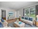 Bright living room with coastal decor, comfortable seating, and natural light, creating a relaxing atmosphere at 308 Plaza Dr, Garner, NC 27529