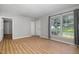 Well-lit living room featuring luxury vinyl plank flooring and neutral paint at 308 Plaza Dr, Garner, NC 27529