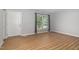 Bright, airy living room with wood floors, a large window, and neutral paint, ready for personalization at 308 Plaza Dr, Garner, NC 27529