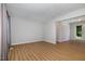 Spacious living room with wood flooring, neutral walls, and ample space, perfect for entertaining guests at 308 Plaza Dr, Garner, NC 27529