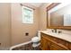Powder room featuring a carved vanity, marble floors and stone counter at 316 Academia Ct, Durham, NC 27713
