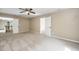 Large bonus room with neutral walls, carpeted floors, multiple closets, and a ceiling fan at 316 Academia Ct, Durham, NC 27713