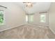 Bright bedroom with vaulted ceiling and large windows that provide ample natural light at 316 Academia Ct, Durham, NC 27713