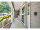View of the spacious front porch, featuring a screen door and Ring doorbell at 316 Academia Ct, Durham, NC 27713