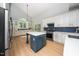 Bright kitchen with an island, stainless appliances, and stylish backsplash at 316 Academia Ct, Durham, NC 27713