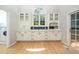 Open kitchen featuring lots of counter space, white cabinetry, and exterior access at 316 Academia Ct, Durham, NC 27713