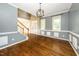 Spacious living room with hardwood floors, modern light fixtures, and ample windows at 316 Academia Ct, Durham, NC 27713