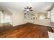 Open-concept living room boasts hardwood floors and an elegant ceiling fan at 316 Academia Ct, Durham, NC 27713