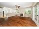 Bright living room with a fireplace, hardwood floors, and views of the kitchen at 316 Academia Ct, Durham, NC 27713