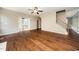 Spacious living room with hardwood flooring, a staircase, and French doors at 316 Academia Ct, Durham, NC 27713