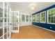 Inviting sunroom with tile floors, big windows, and views of lush greenery at 316 Academia Ct, Durham, NC 27713
