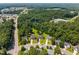 Aerial view of the neighborhood showcasing the homes and surrounding trees, conveniently located near town at 3306 Meadowrun Dr, Durham, NC 27707