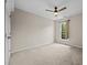 This bedroom features carpet flooring, a ceiling fan and a bright window at 3306 Meadowrun Dr, Durham, NC 27707