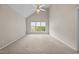 Bedroom with carpet flooring, vaulted ceilings, and large window views at 3306 Meadowrun Dr, Durham, NC 27707