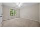 This bedroom features neutral walls, a ceiling fan, and bright natural light at 3306 Meadowrun Dr, Durham, NC 27707