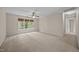 Carpeted bedroom with natural light from the large window, creating a cozy atmosphere at 3306 Meadowrun Dr, Durham, NC 27707