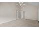 Spacious carpeted bedroom with ceiling fan and multiple closets at 3306 Meadowrun Dr, Durham, NC 27707