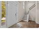 Inviting foyer featuring hardwood floors and staircase at 3306 Meadowrun Dr, Durham, NC 27707