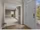 Welcoming foyer with hardwood floors leads to a bright and airy living space at 3306 Meadowrun Dr, Durham, NC 27707