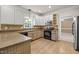 Kitchen with stone countertops, custom cabinets, and stainless steel microwave at 3306 Meadowrun Dr, Durham, NC 27707