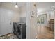 Convenient laundry area with modern washer and dryer, tiled flooring, and easy access at 3306 Meadowrun Dr, Durham, NC 27707