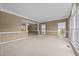 Spacious room featuring carpet, bright windows and pillars at 3306 Meadowrun Dr, Durham, NC 27707