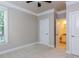 Neutral bedroom with natural light coming in, with an ensuite bathroom off to the side at 354 Crimson Way, Pittsboro, NC 27312