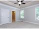 Neutral bedroom with natural light coming in from the window and a small ensuite bathroom at 354 Crimson Way, Pittsboro, NC 27312