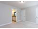 An unfurnished bedroom with ensuite, showing an ensuite bathroom, closet, and two doorways at 354 Crimson Way, Pittsboro, NC 27312