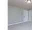An unfurnished bedroom with neutral walls, trim and carpet and 2 doorways at 354 Crimson Way, Pittsboro, NC 27312