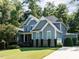 Lovely two-story home on a sprawling lawn featuring lush greenery and a welcoming driveway at 354 Crimson Way, Pittsboro, NC 27312