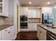 Kitchen includes stainless steel appliances, granite countertops, and ample cabinet space for storage and organization at 354 Crimson Way, Pittsboro, NC 27312
