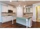 Modern kitchen featuring granite countertops, stainless steel appliances, and a center island for meal preparation at 354 Crimson Way, Pittsboro, NC 27312