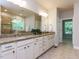 Main bathroom featuring double sinks and a granite countertop, with a standalone shower and tub at 354 Crimson Way, Pittsboro, NC 27312
