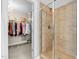 Primary bathroom featuring a walk-in closet, tiled shower, and glass shower door at 3650 Pleasants Ridge Dr, Wake Forest, NC 27587