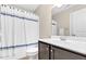 Bathroom featuring a vanity with dark wood cabinets, sink, and white shower curtain at 3650 Pleasants Ridge Dr, Wake Forest, NC 27587