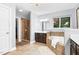 Primary bathroom with shower, double vanity, soaker tub, chandelier, and tile floors at 3650 Pleasants Ridge Dr, Wake Forest, NC 27587