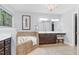 Primary bathroom with soaker tub, window, chandelier, and dark wood cabinets at 3650 Pleasants Ridge Dr, Wake Forest, NC 27587