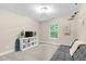 Neutral-toned bedroom featuring plush carpeting, natural light, and decorative airplane accents at 3650 Pleasants Ridge Dr, Wake Forest, NC 27587