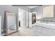 Cozy bedroom featuring a large mirror, doorways to other rooms, and carpeted floors at 3650 Pleasants Ridge Dr, Wake Forest, NC 27587
